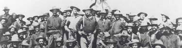 Colonel Theodore Roosevelt, center, posing with his Rough Riders.